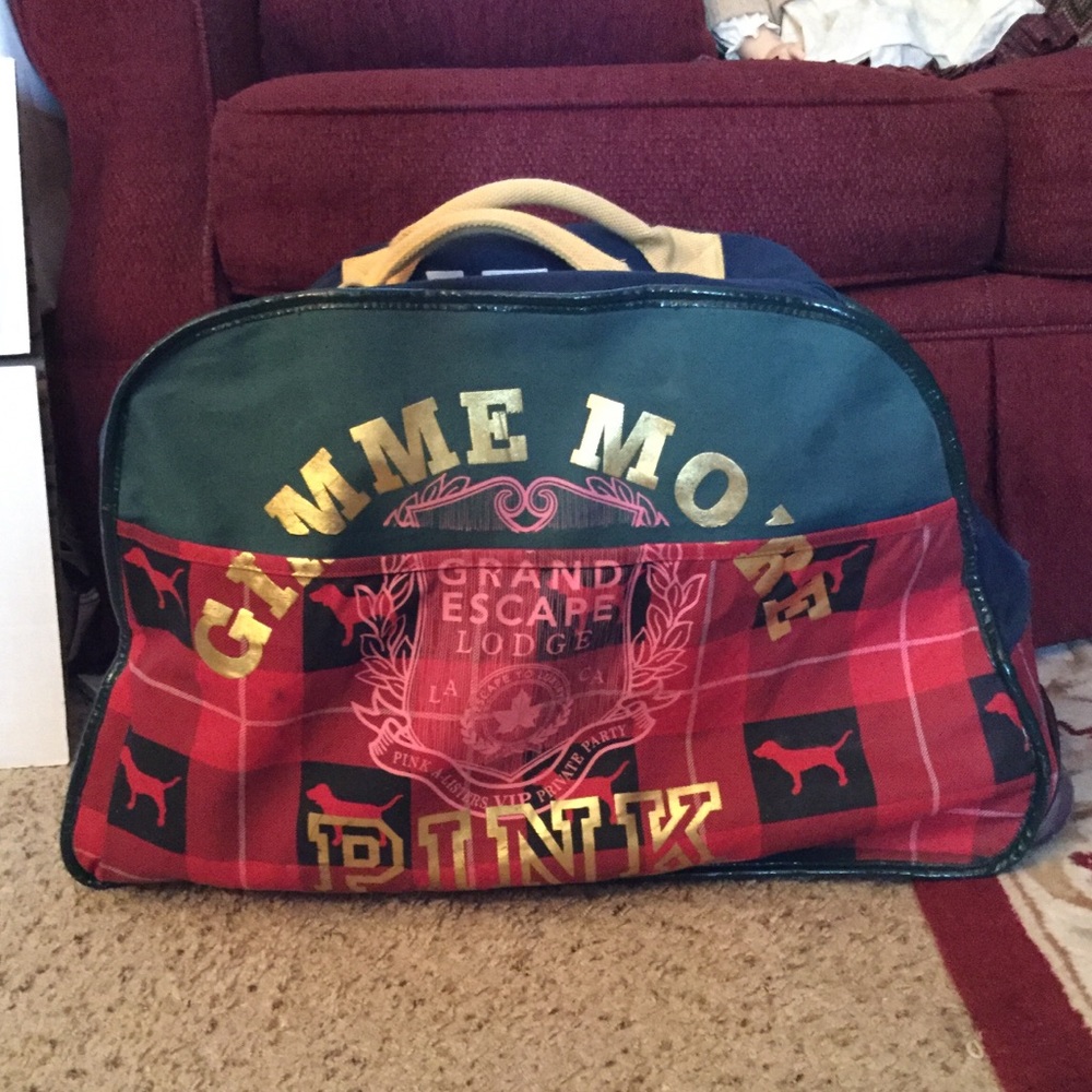 Sold PINK VICTORIA’S SECRET ROLLING DUFFLE LUGGAGE - Picture 1 of 8